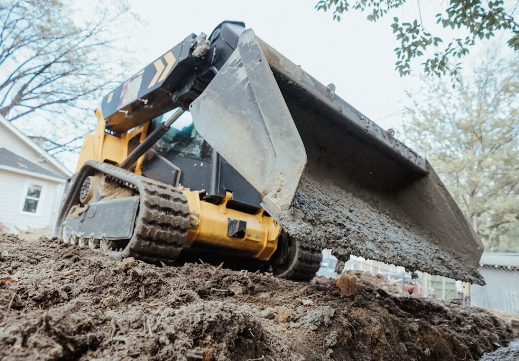 Site pre And Excavation services including land clearing, structural pads, utility trenching, and driveway installation.